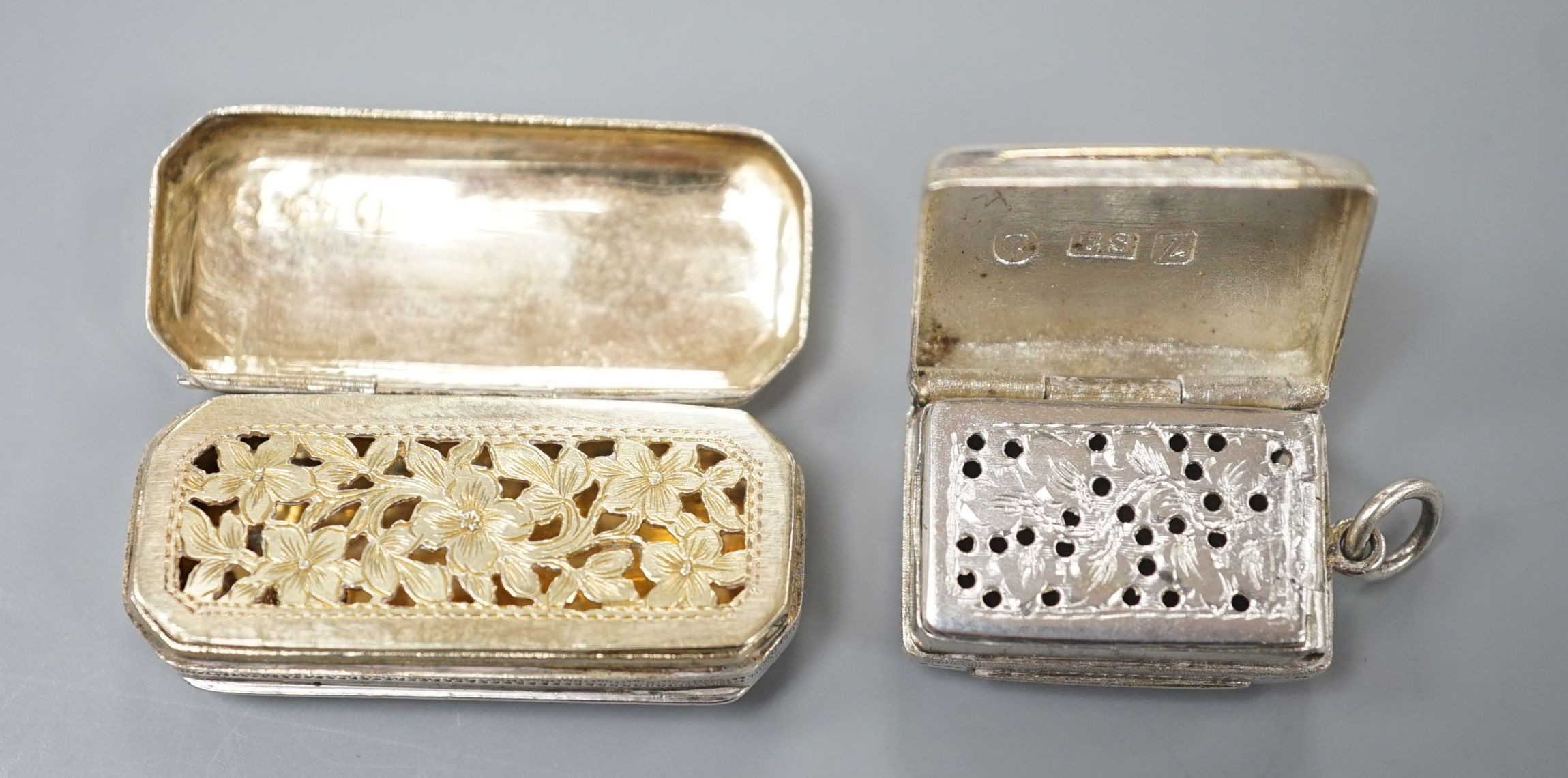 A Victorian silver gilt vinaigrette, by Edward Smith, Birmingham, 1848, 22mm and an earlier octagonal silver vinaigrette by Joseph Wilmore, Birmingham, 1818.